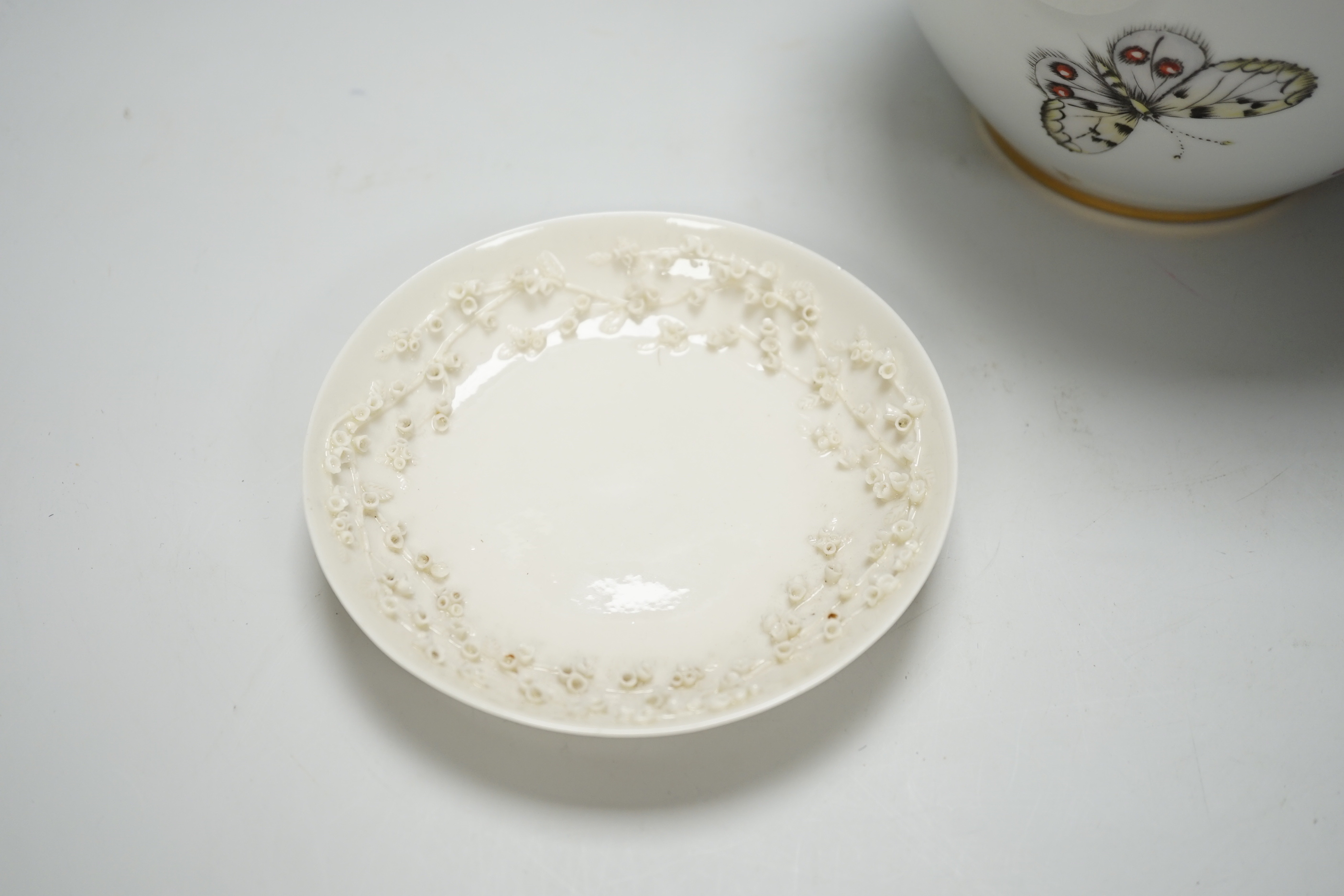 A Nyon style porcelain hand painted vase and a Belleek style coffee cup and saucer, tallest 18cm